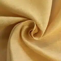 Folded hotel bed linen in natural cotton